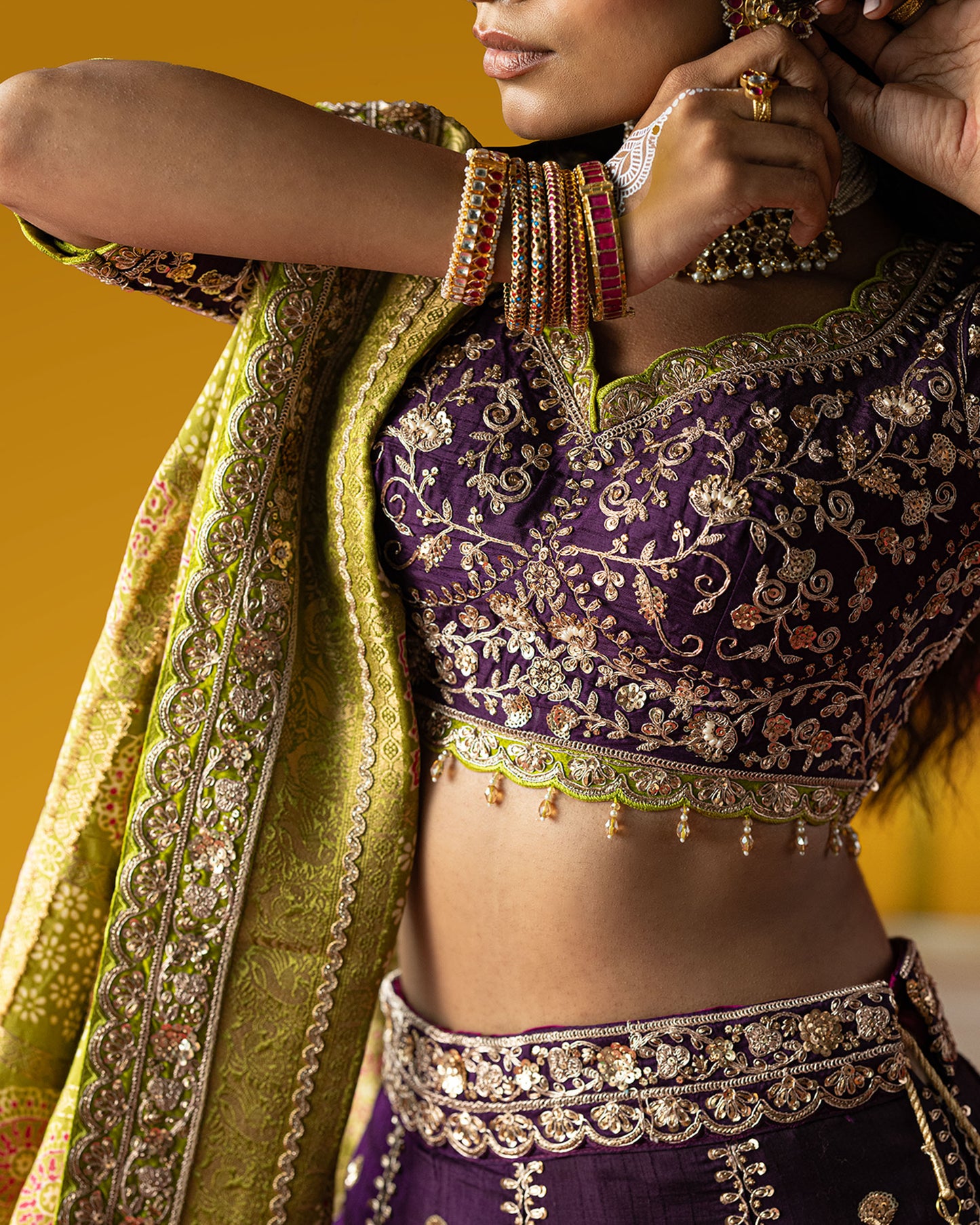 purple lehenga with pistachio-green ajarakh duppata