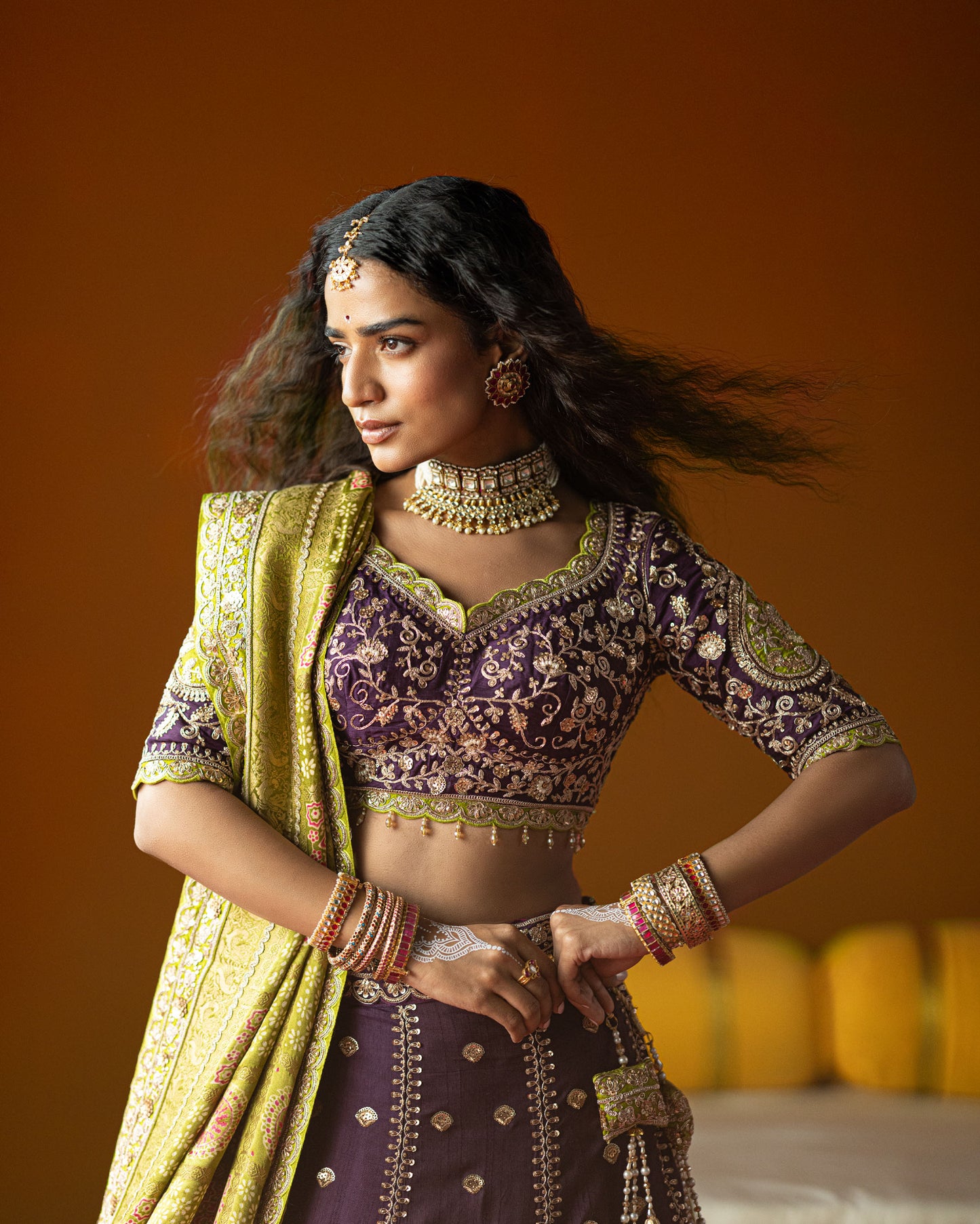 purple lehenga with pistachio-green ajarakh duppata