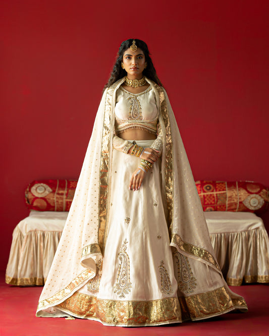 Offwhite self elegante lehenga with delicate duppata and embellished blouse