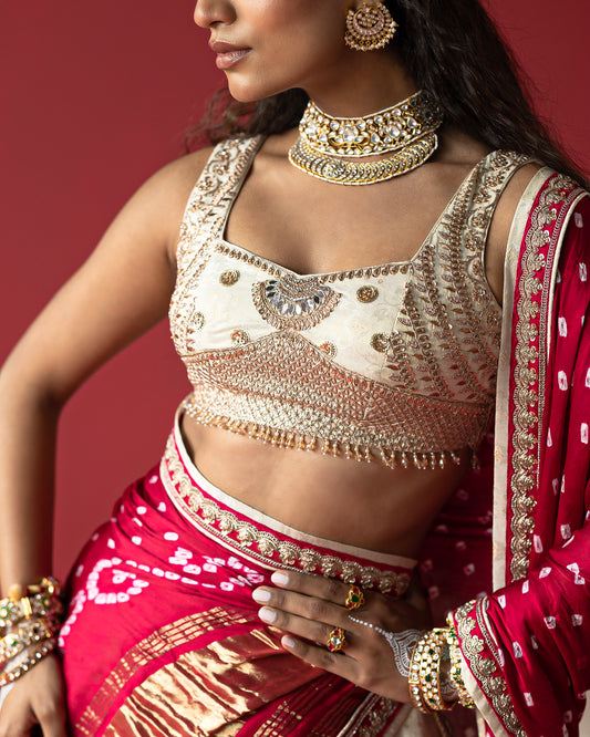 Offwhite jari tissue jeq. Lehenga with Rani bandhej duppata